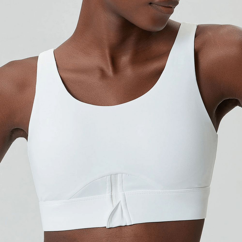 Close-up of a white vibrant yoga fitness bra, featuring a sleek design ideal for flexible, breathable sportswear during workouts.